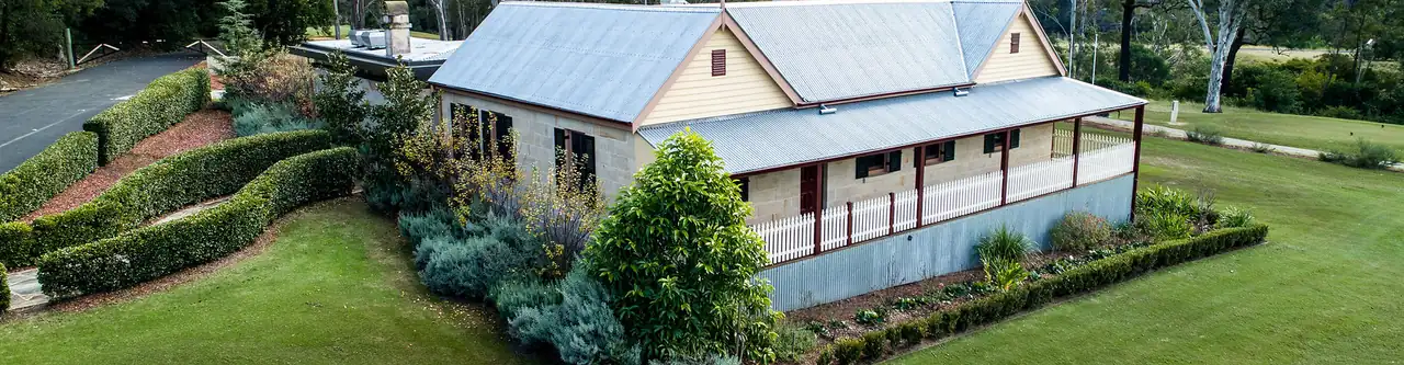 Landscaped grounds with trimmed hedges around a house