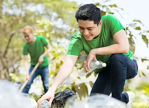 Landscapers clearing yard debris during a seasonal cleanup