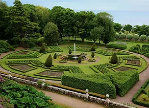 Formal garden with clipped hedges and lawn